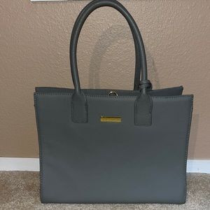 This is a once used Joy and Iman bag. There are no scratches or any marks on it.